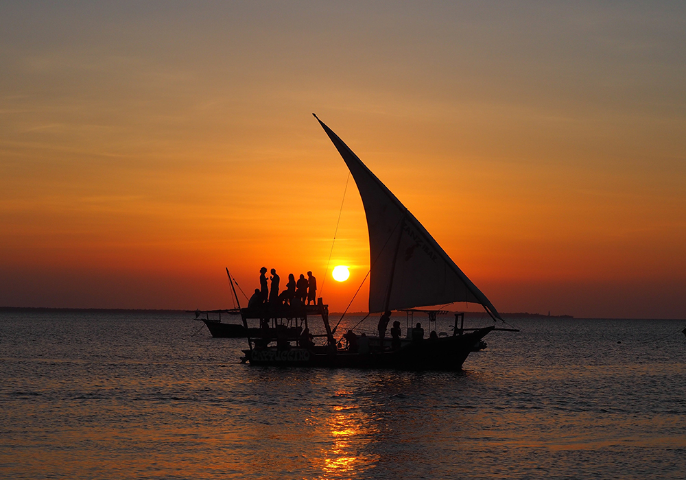 Take a dhow trip at dusk.
